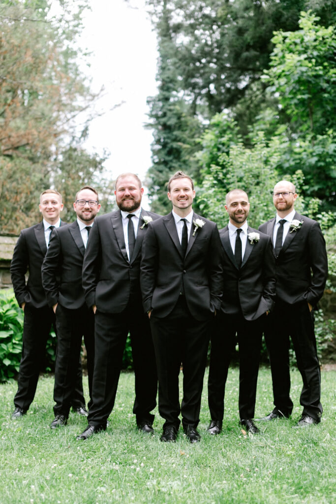 groom with his groomsmen by Emily Wren Photography