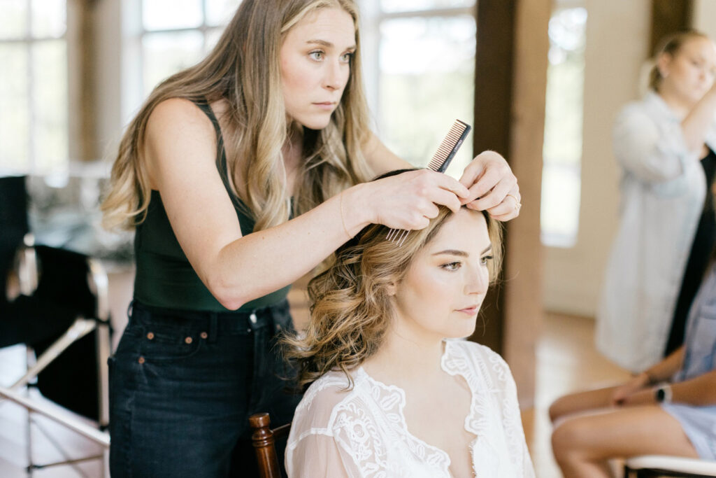 bride getting her hair & makeup done for her summer Pensylvania wedding