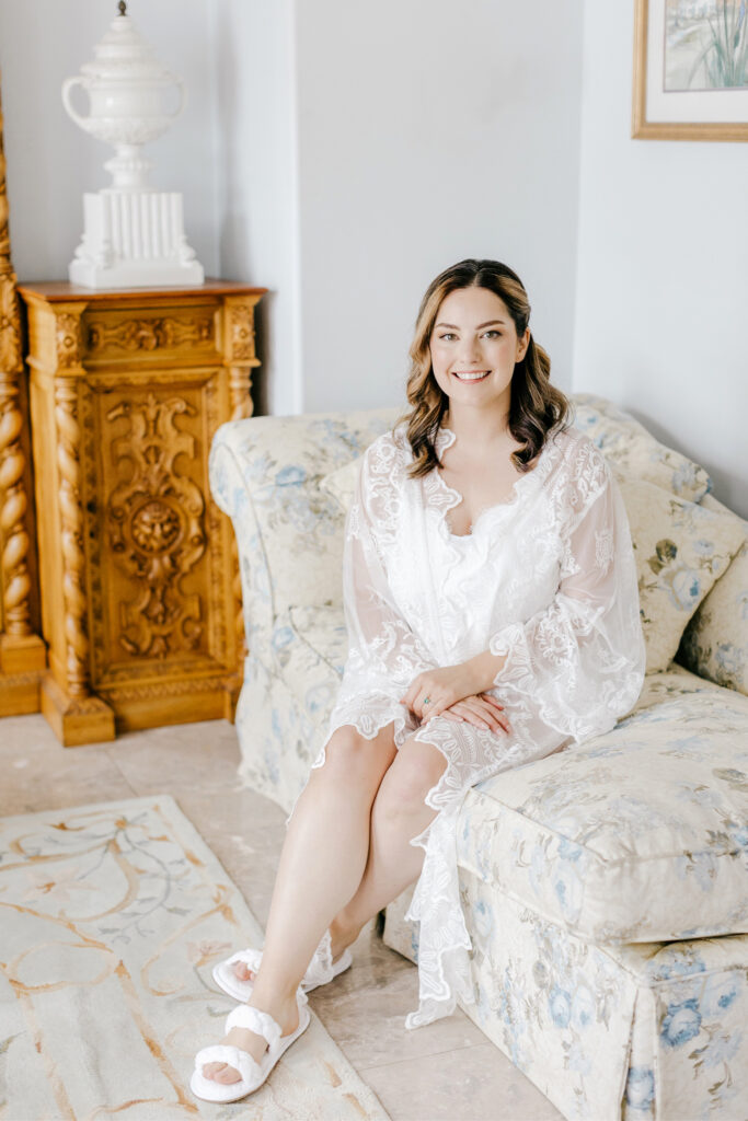 bride in silk pajamas and lace robe as she gets ready for her Pennsylvania wedding