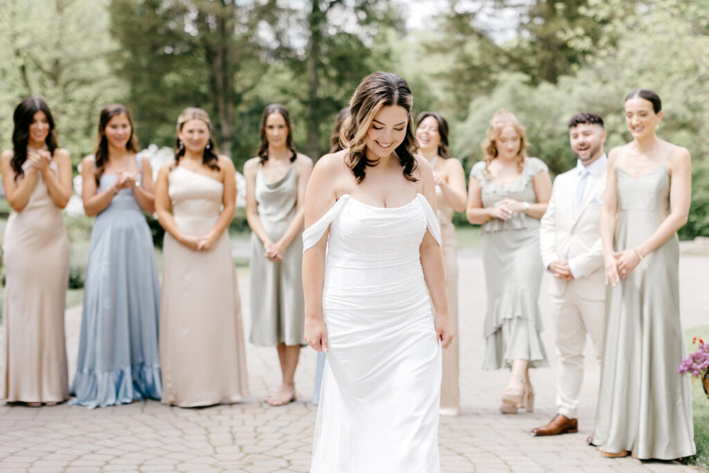 brides first look with her bridesmaids at the Inn at Barley Sheaf