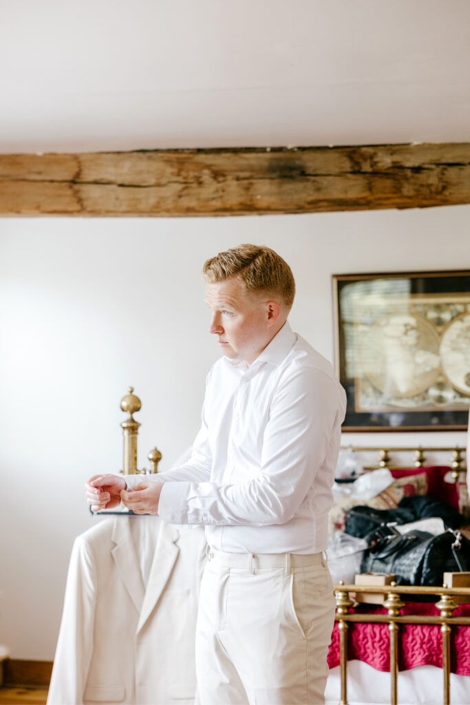 groom getting ready for his summer Pennsylvania wedding