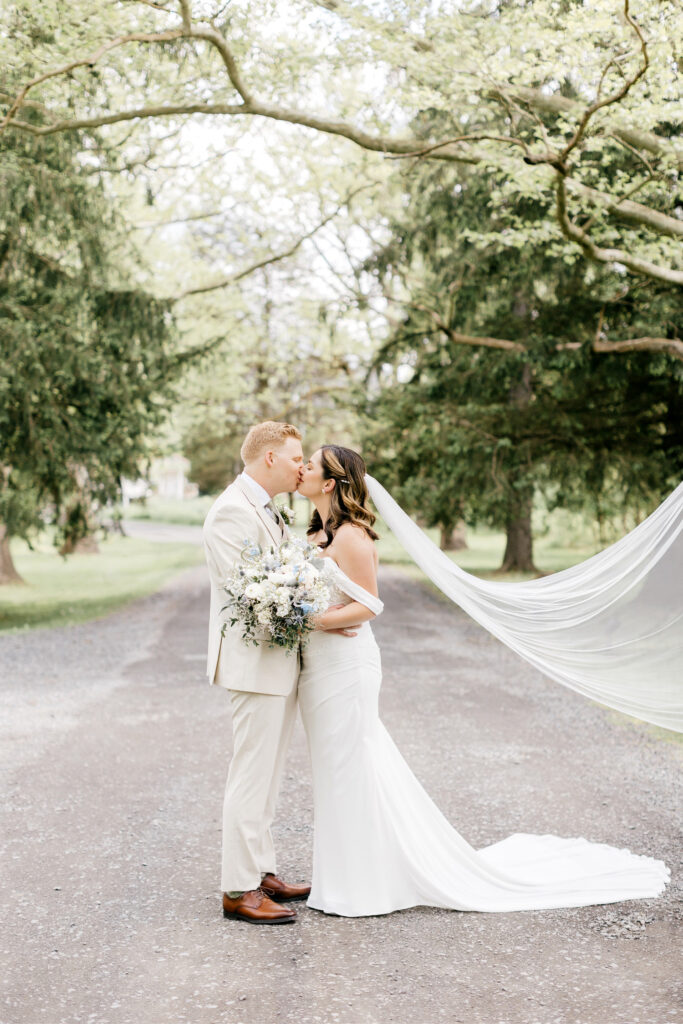 bride & groom kissing portrait before their summer wedding at the inn at barley sheaf