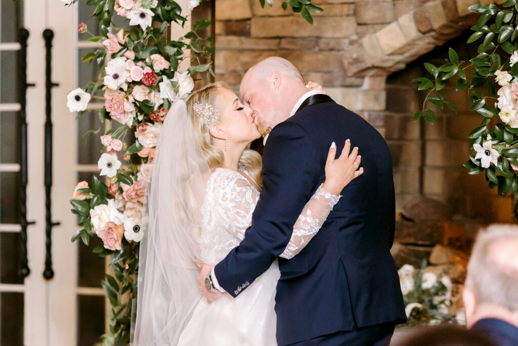 bride & grooms first kiss at the ryland inn wedding ceremony