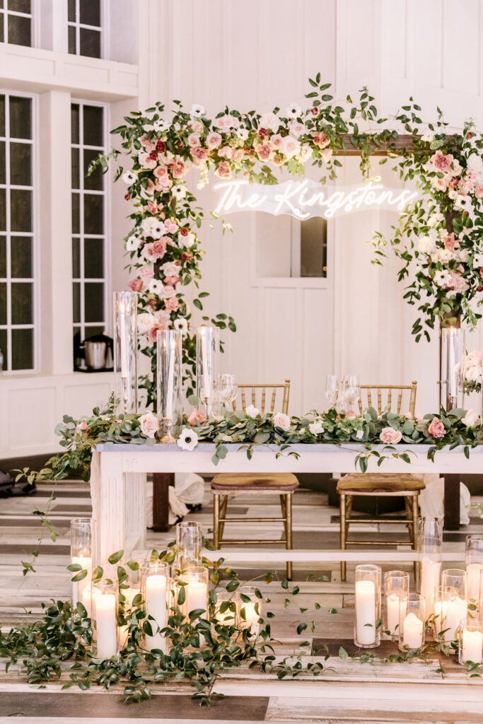 pink & white floral decorated sweetheart wedding reception table by Emily Wren Photography