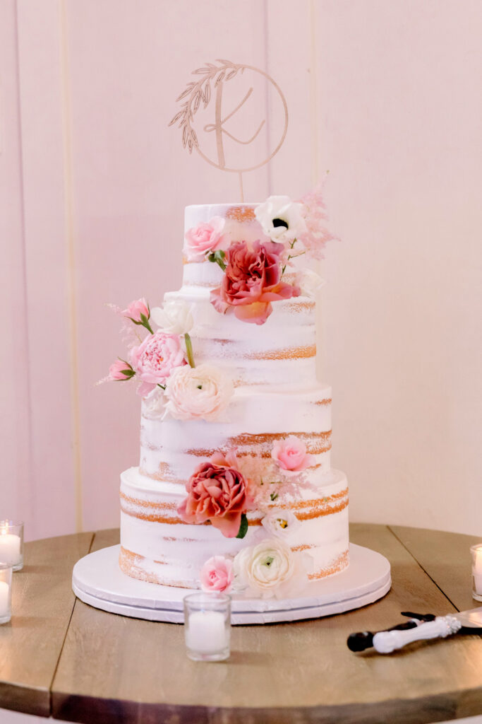 pink floral naked 4 tier wedding cake