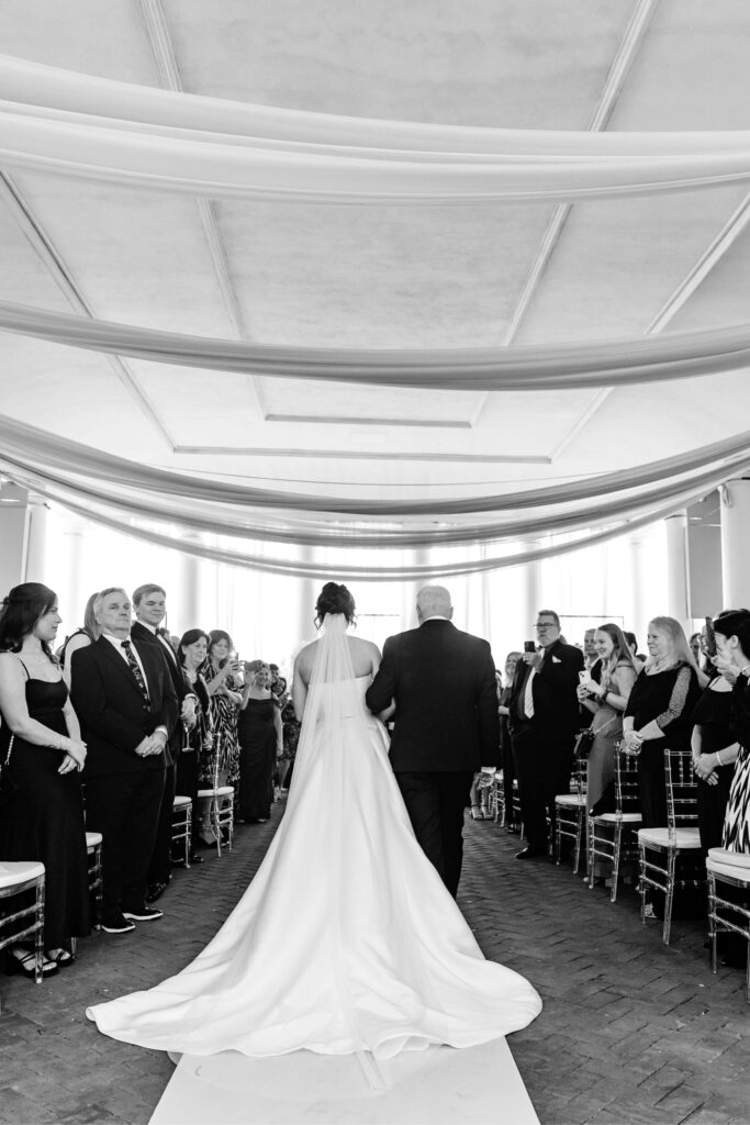 bride walking down the aisle at her summer Cescaphe wedding