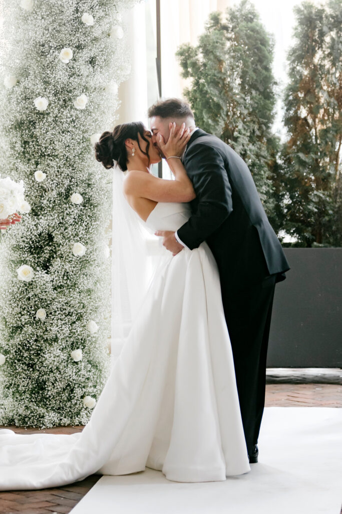 bride & grooms first kiss at Cescaphe wedding ceremony