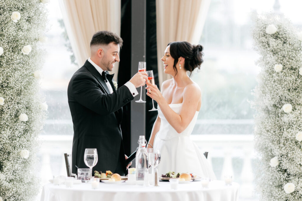 bride & groom toasting at Cescaphe wedding reception