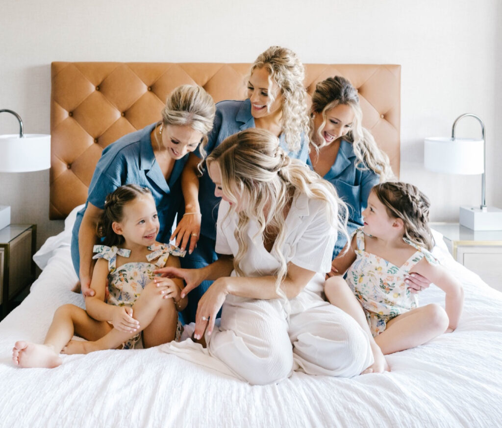 bride with her bridal party in matching pajamas