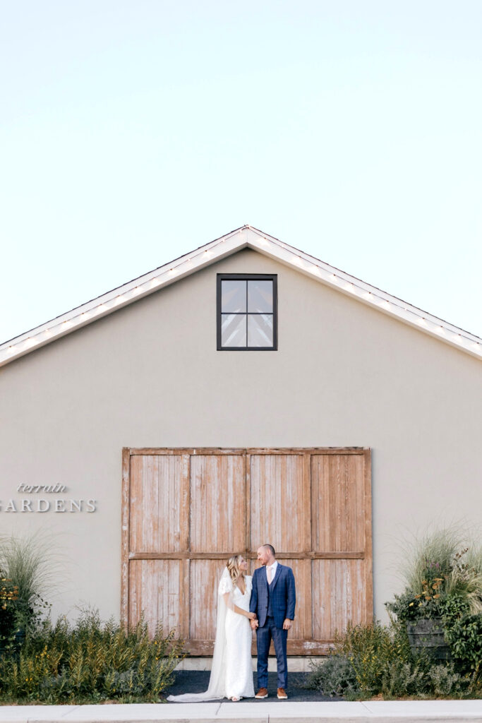 bride & groom outside Terrain at Delaware Valley University by Emily Wren Photography