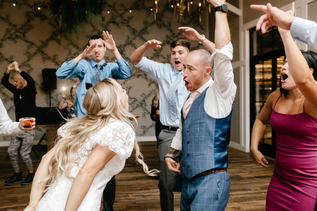 bride & groom having fun at their Terrain wedding reception