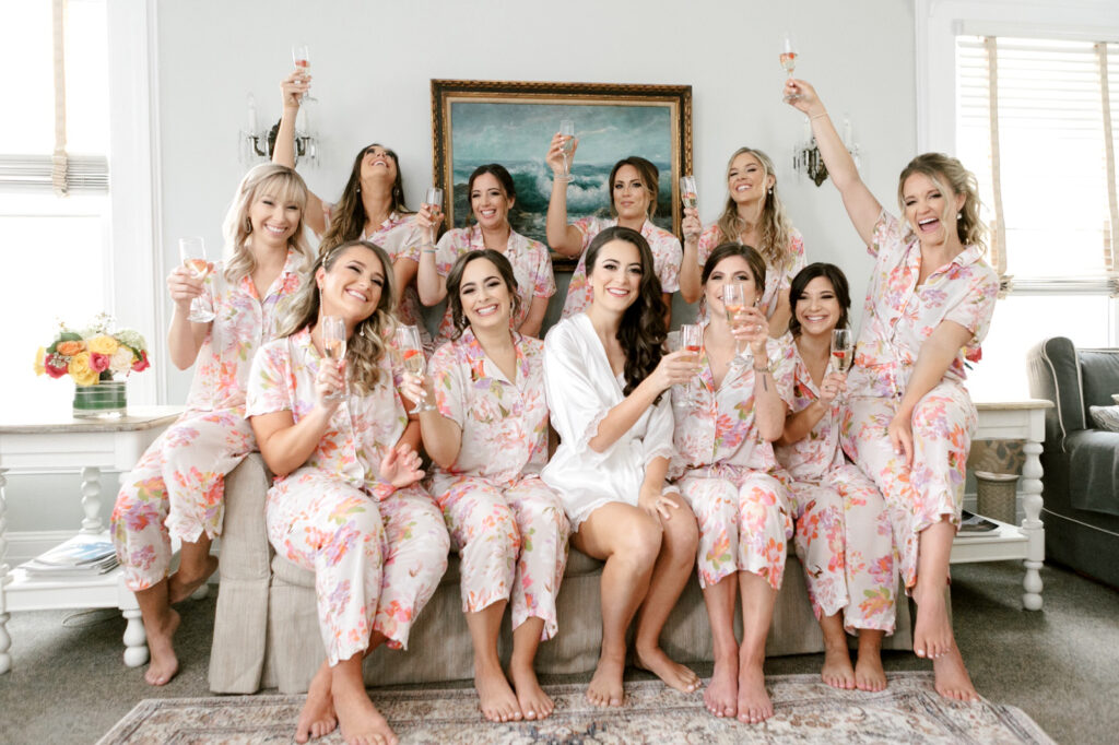 bride with her bridesmaids in matching pink floral pajamas