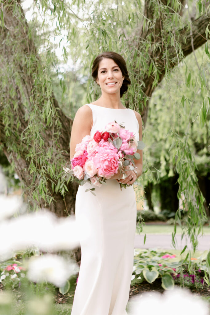 New Jersey bride in a Cape May garden on her summer wedding day by Emily Wren Photography