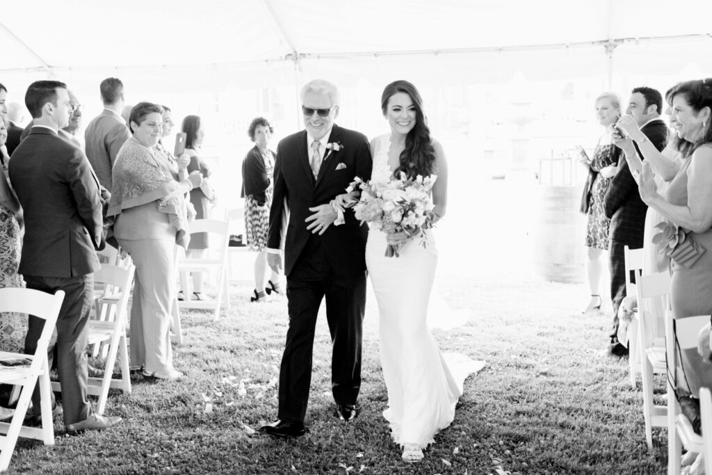 bride walking down the aisle during outdoor New Jersey wedding ceremony