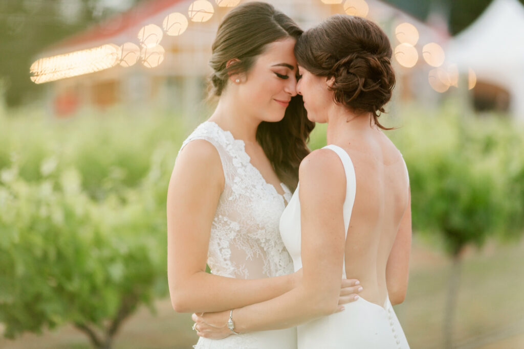 same sex lesbian brides at Willow Creek Winery during sunset by Emily Wren Photography