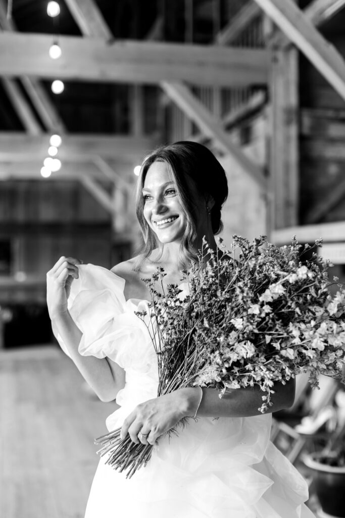 bride holding lavender flowers at Warwick Furnace Farms