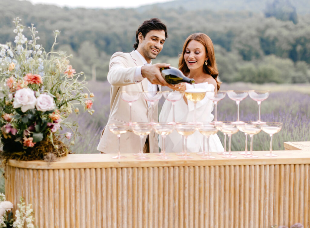 bride & groom champagne tower in Lavender field