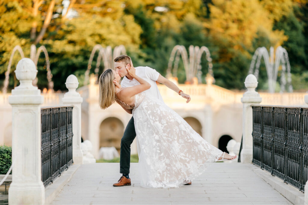 engagement photos in front of fountain at Longwood Gardens