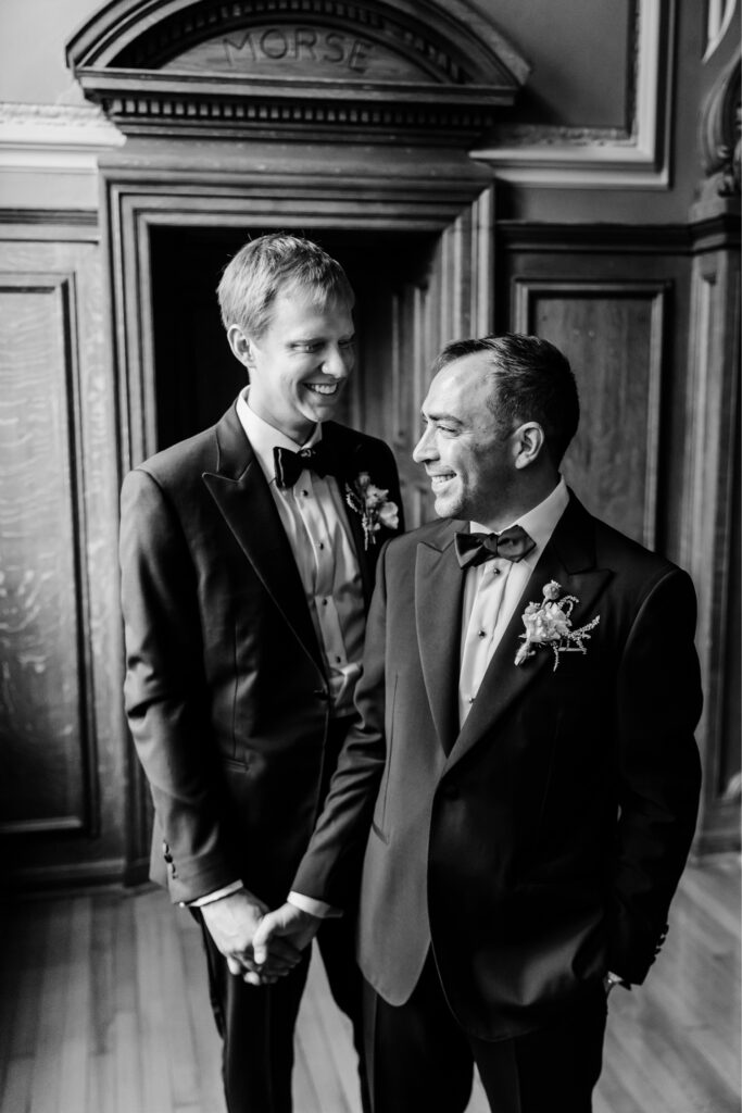 same sex grooms candid wedding portrait by Emily Wren Photography