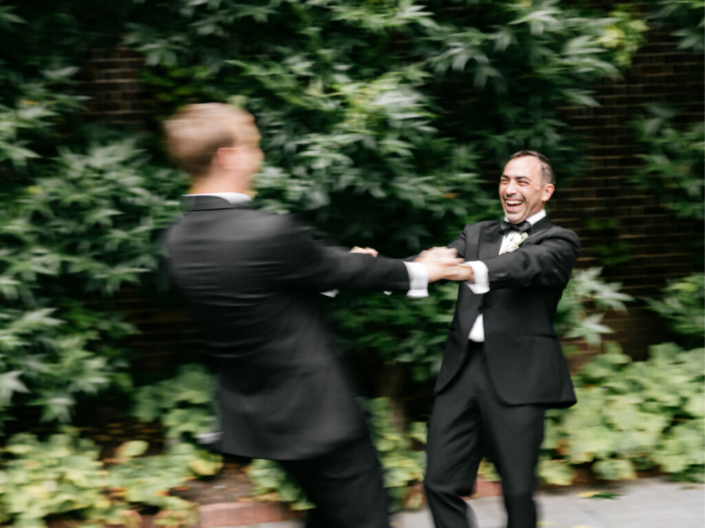 grooms spinning and dancing in College of Physicians garden in Philadelphia