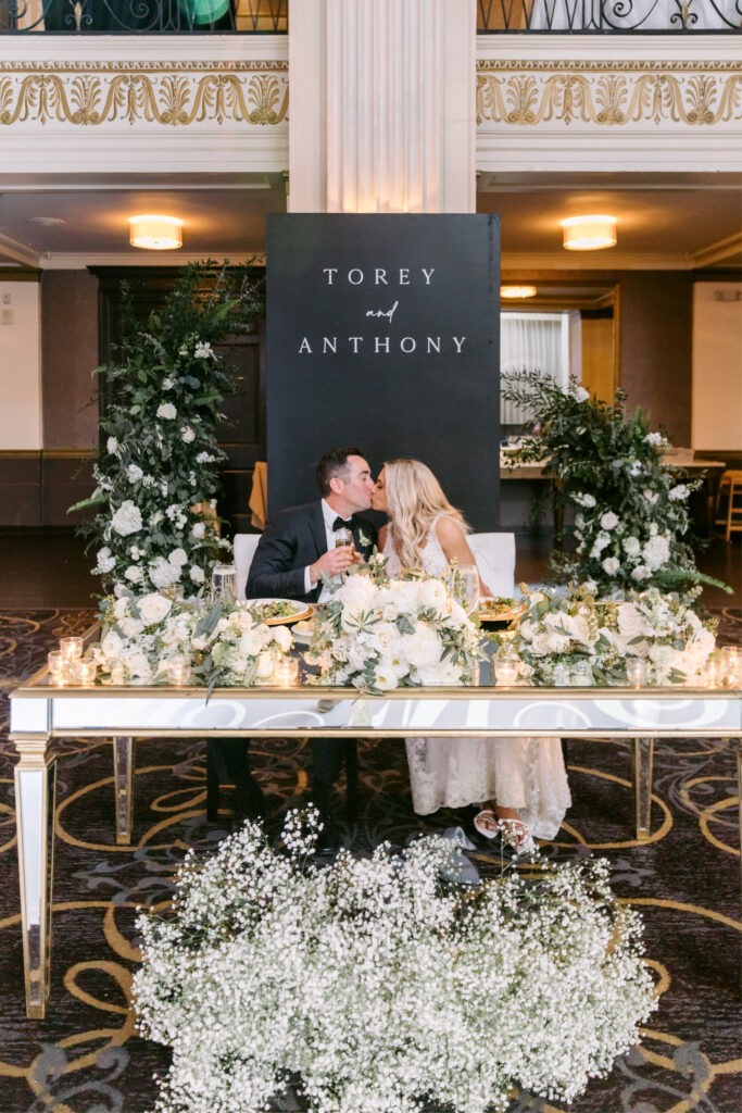 bride & groom at their elegant sweetheart table at Cescsaphe wedding reception