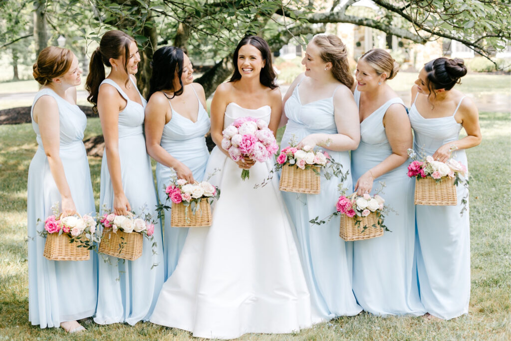 bride with bridemaids in light blue bridesmaid dresses