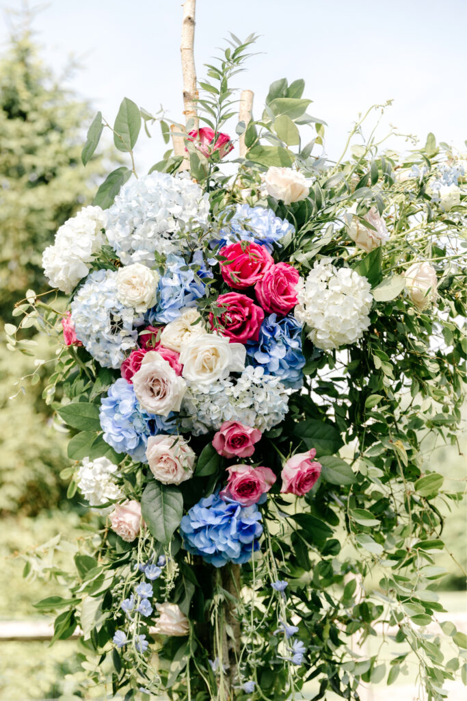 vibrant pink, blue and white summer wedding flowers by Emily Wren Photography