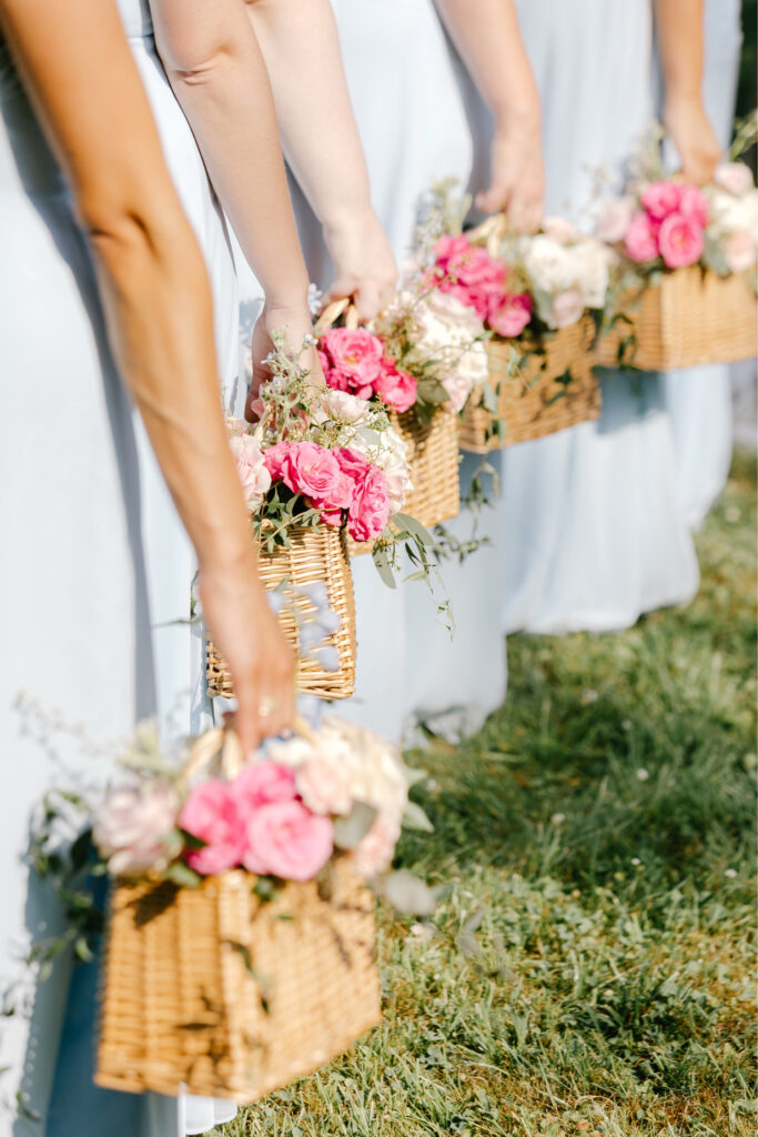 pink bridesmaid bouquets in wicker baskets