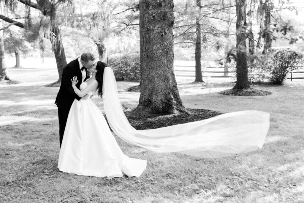 bride & groom kissing on their summer wedding day