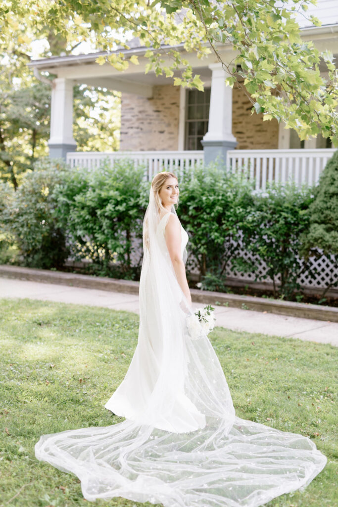 portrait of bride before her elegant lakeside wedding in Pennsylvania