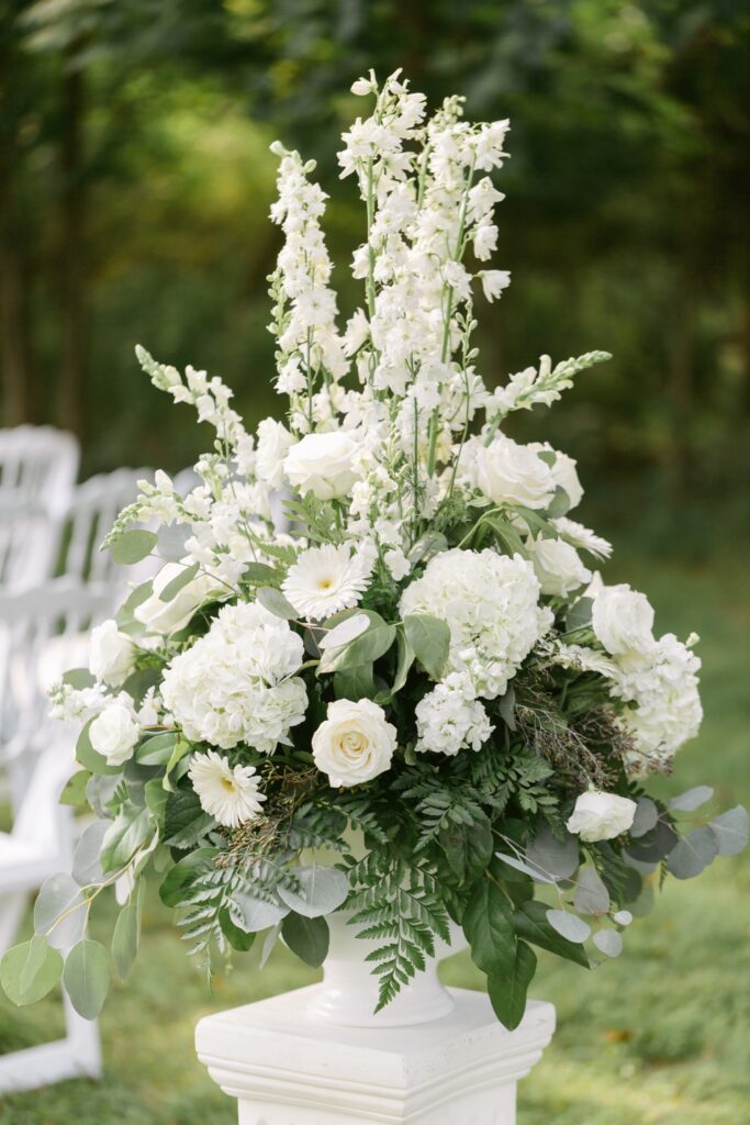 white floral decor for outdoor garden wedding ceremony