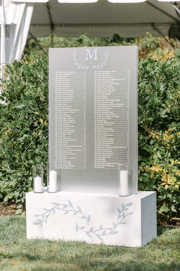 transparent wedding reception seating chart sign by Emily Wren Photography