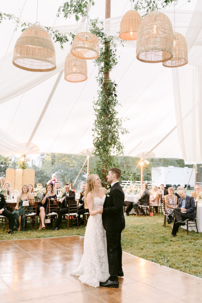 bride & groom's first dance at their outdoor whimsical wedding reception under a white tent at the Inn at Barley Sheaf