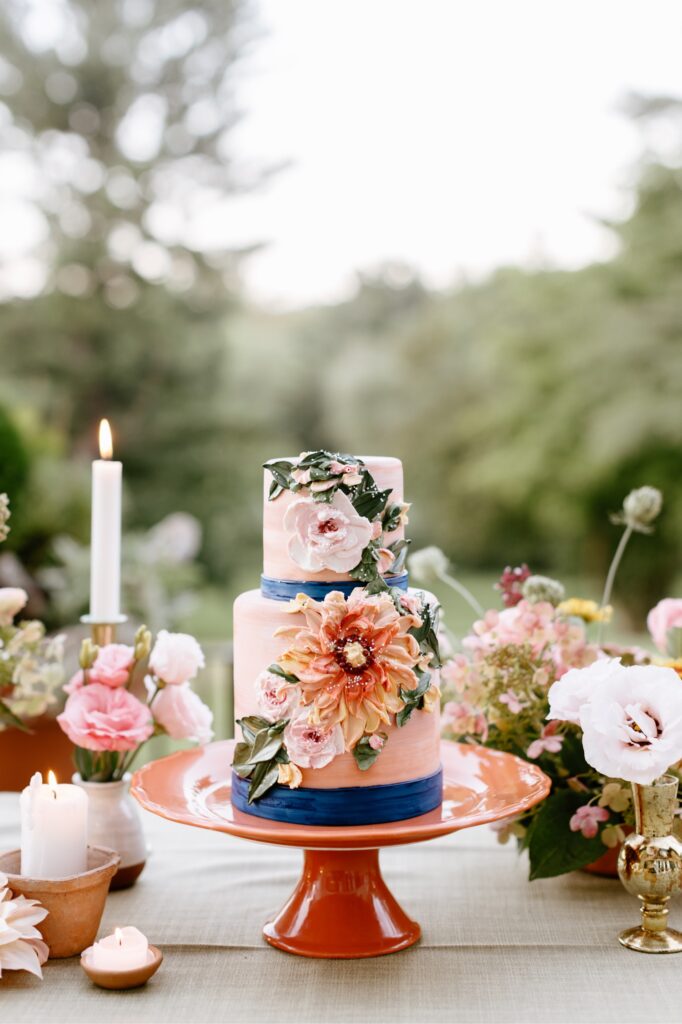 2 tier pink and blue floral wedding cake from Frosted Fox bakery