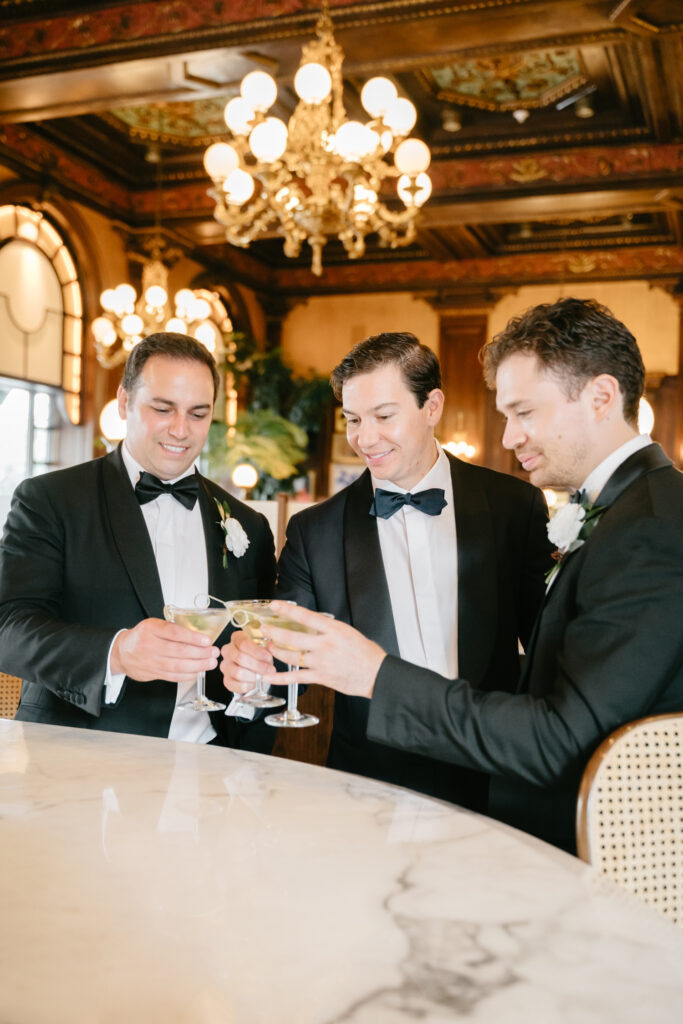 groom drinking with groomsmen before Delaware wedding day