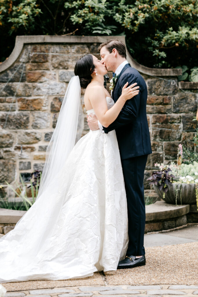 bride & grooms first kiss at Winterthur Musuem wedding ceremony