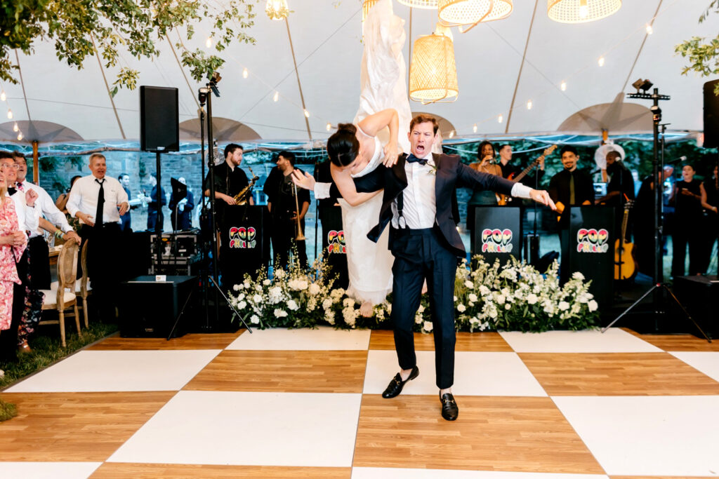 crazy and fun bride & grooms first dance at summer wedding reception