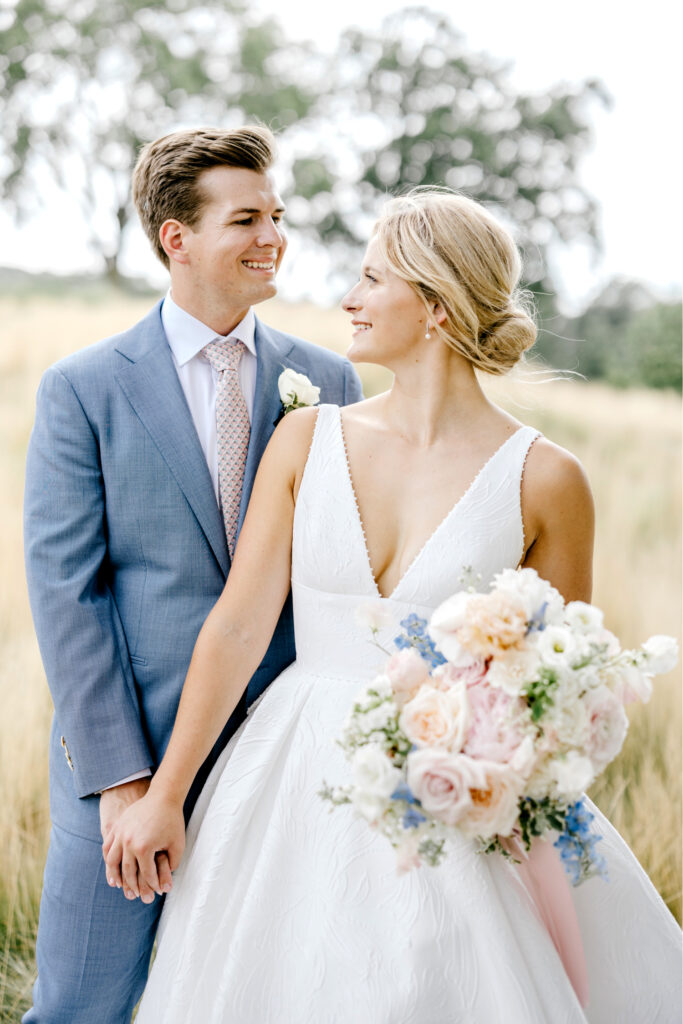 bride and groom portrait session in a field at Gulph Mills Golf Club by Emily Wren Photography