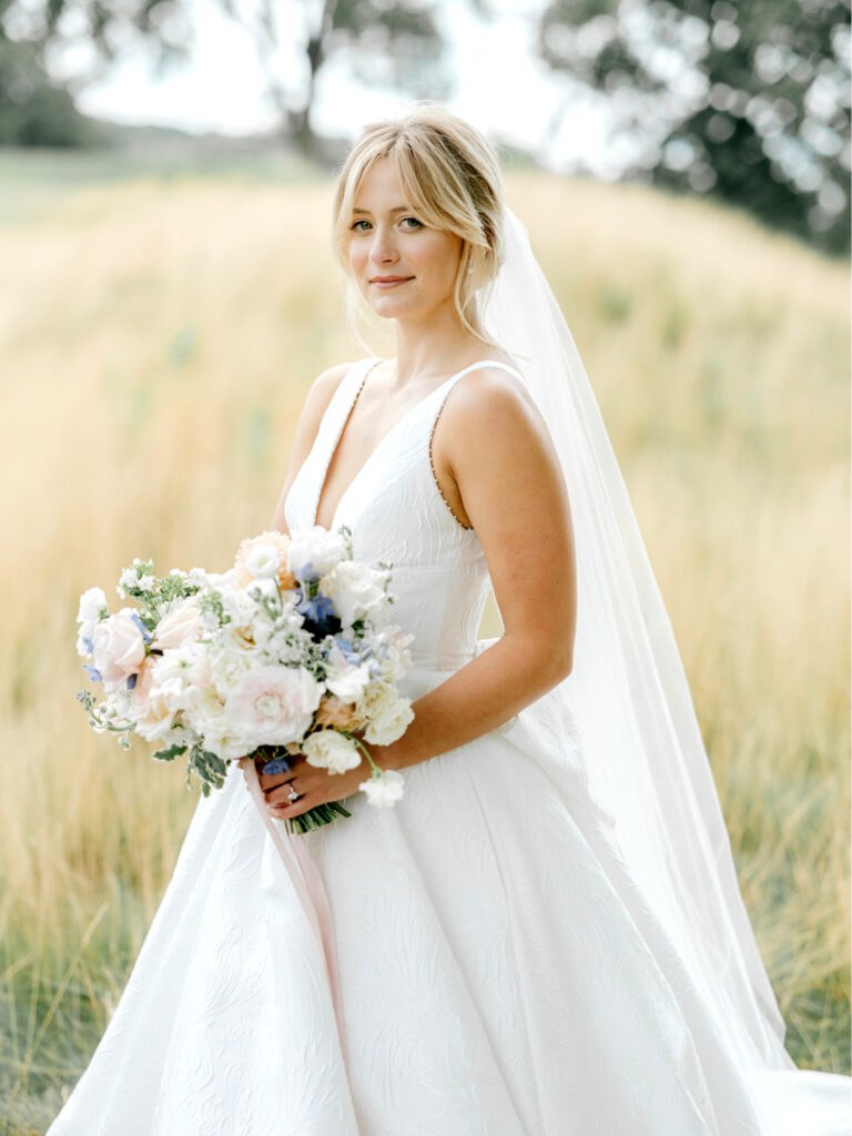 stunning bride in a field at Gulph Mills Golf Club