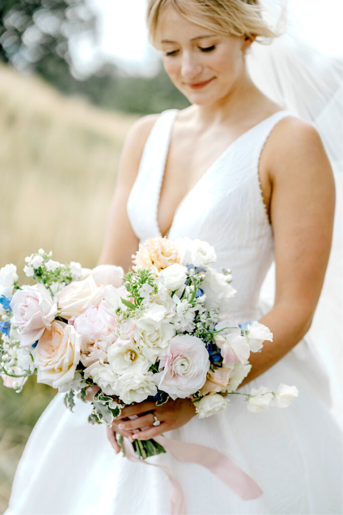 pink white and blue bridal bouquet