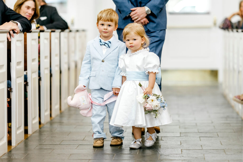 flower girl and ring bearer in matching blue attire