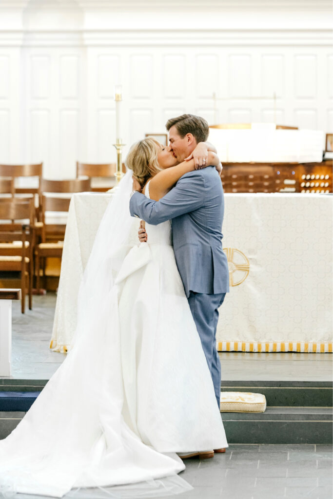 bride & grooms first kiss at St Davids Episcopal Church