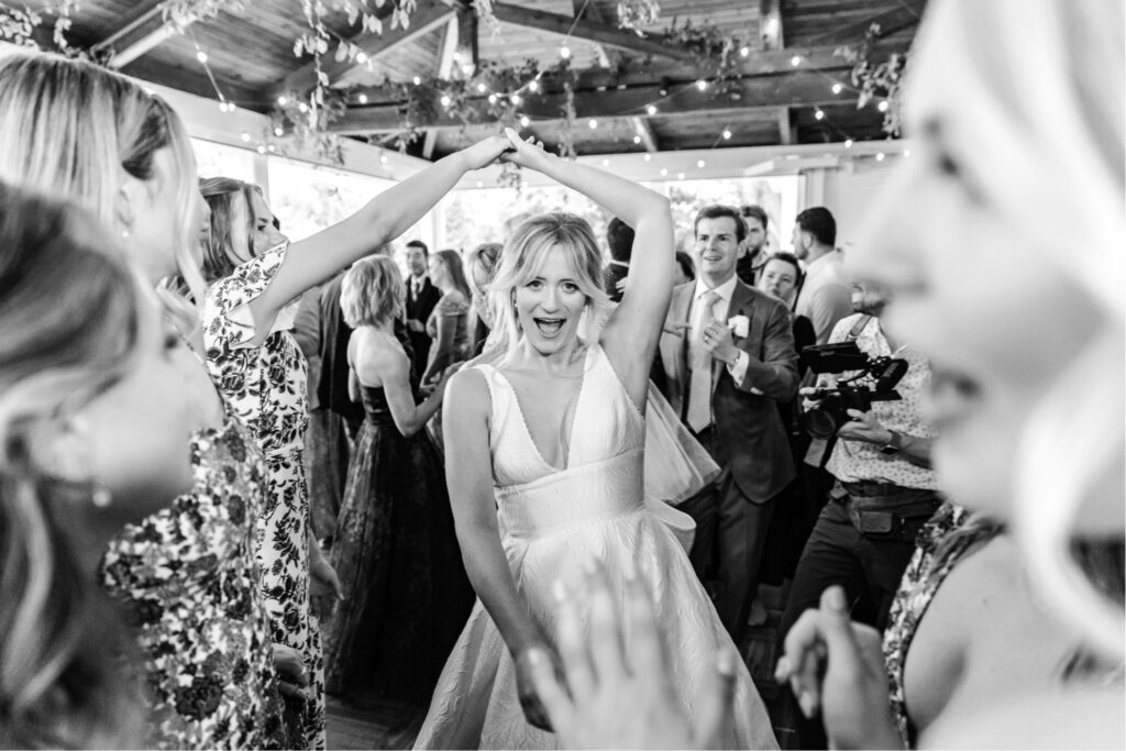 bride dancing during her Philadelphia summer wedding reception by Emily Wren Photography