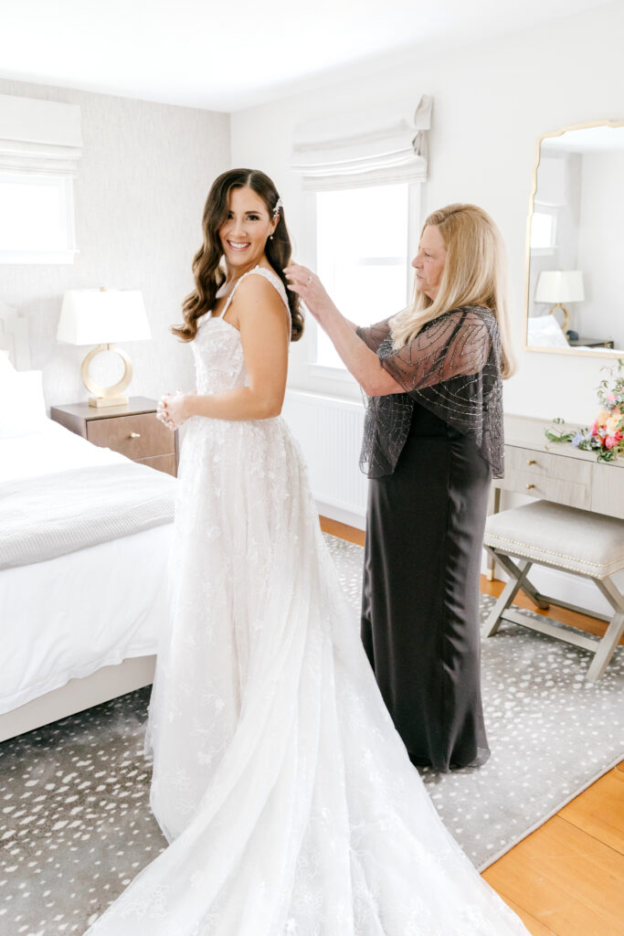 bride getting ready with her mother for Vermont wedding day