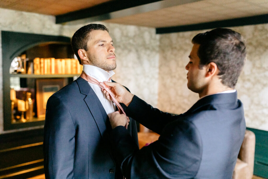 groom getting ready for summer Vermont wedding