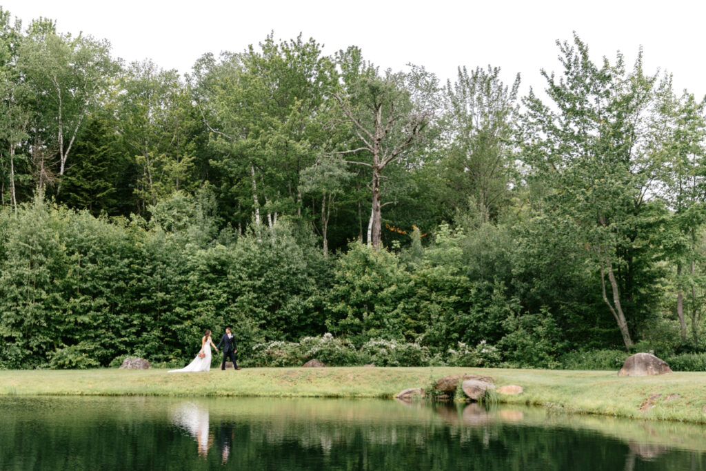 bride & groom walking through the gardens at The Hermitage Inn