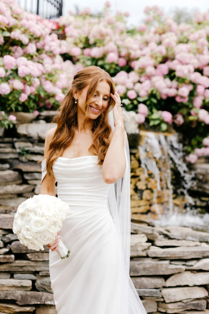 New Jersey bride in a garden with pink flowers