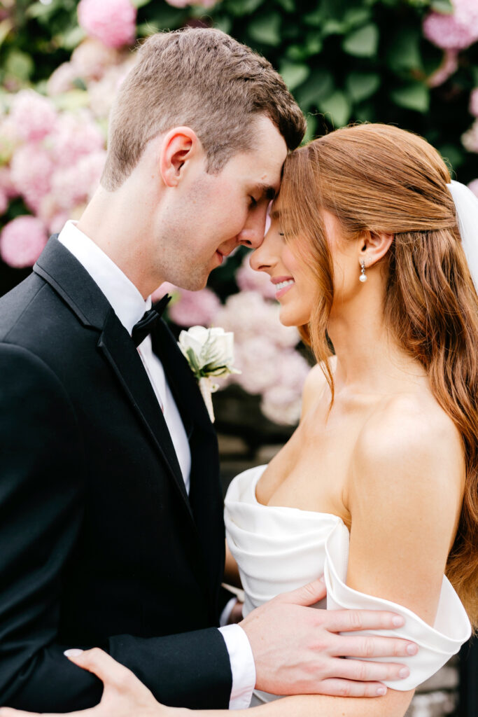 bride and groom in New Jersey pink floral garden