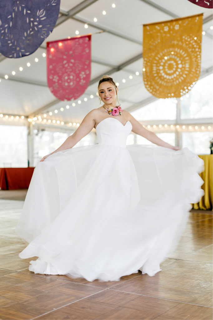 bride dancing at her Tyler Gardens wedding reception