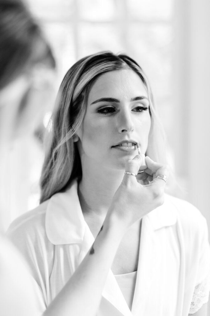 bride getting her wedding day makeup done